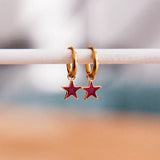 Orecchini con mini stella — viola/oro